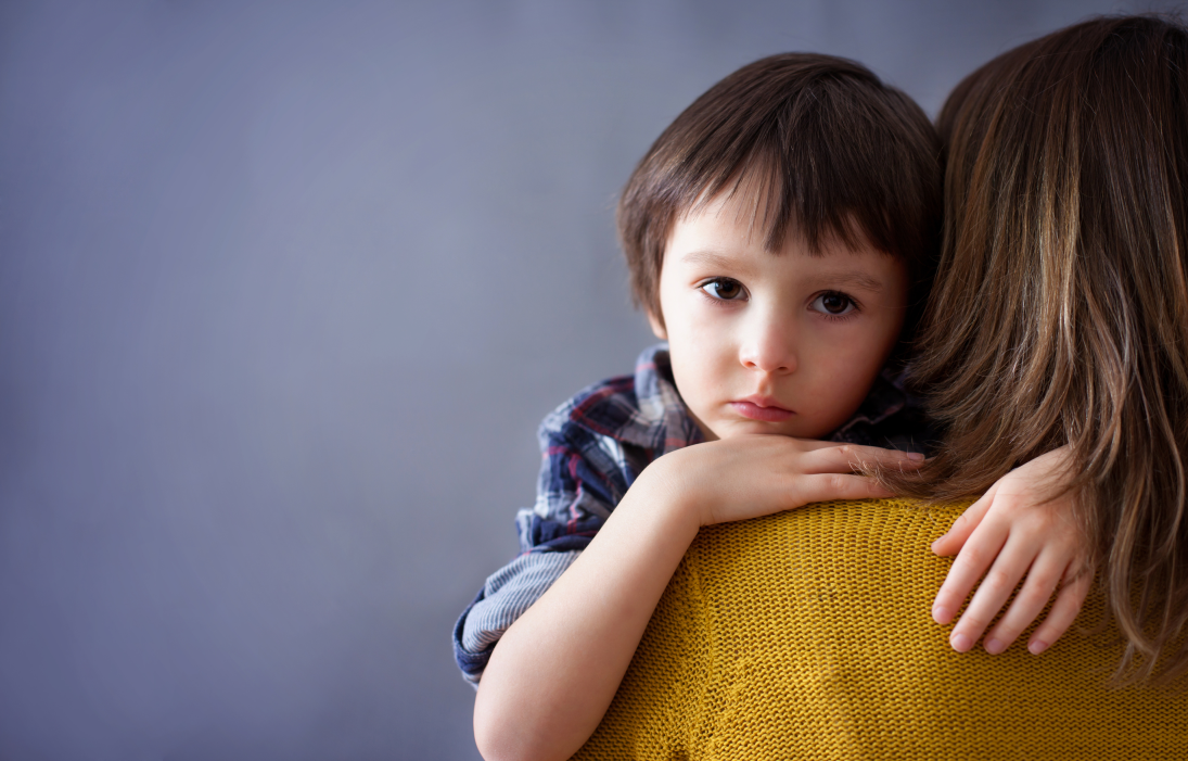 Child held by woman